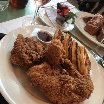 Raymond's - Chicken and waffles with siracha maple syrup - American Near Me - Montclair, New Jersey Raymond's - Chicken and waffles with siracha maple syrup - American Near Me - Montclair, New Jersey