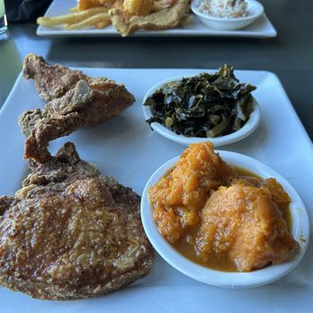 Cassandra's on the River - Fried pork chops with candied yams and greens - Seafood Near Me - Shreveport, Louisiana