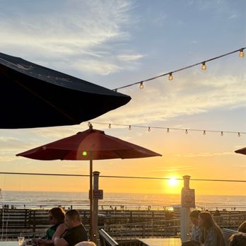 Wooly's - Sunset view from the deck at Wooly's - Seafood Near Me - Pismo Beach, California Wooly's - Sunset view from the deck at Wooly's - Seafood Near Me - Pismo Beach, California