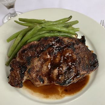 Midtown Bistro - Rib eye dinner. Garlic green chile mash potatoes underneath. - New American Near Me - Santa Fe, New Mexico