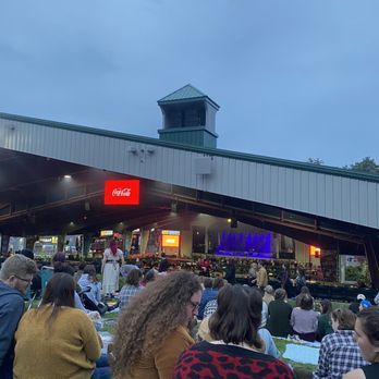 Bank NH Pavillion - a crowd of people sitting on the grass - Music Venues Near Me - Gilford, New Hampshire Bank NH Pavillion - a crowd of people sitting on the grass - Music Venues Near Me - Gilford, New Hampshire