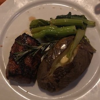 Buzz's - 6 oz sirloin steak med. with choy sum veggies and baked potato. Potato tasted a little burnt I think I will get the garlic mash next time. - Steakhouses Near Me - Kailua, Hawaii