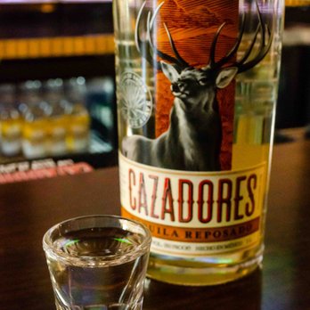 Dreamers Classic Bar - a shot glass and a bottle - Bars Near Me - St. Francis, Wisconsin Dreamers Classic Bar - a shot glass and a bottle - Bars Near Me - St. Francis, Wisconsin
