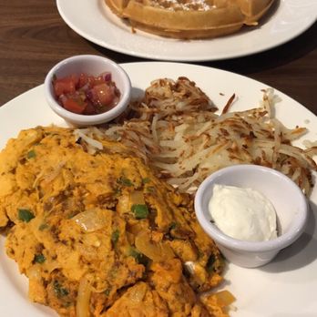 Elly's Brunch & Cafe - Ole omelette with hash browns and a side of sour cream and salsa. - Breakfast & Brunch Near Me - Phoenix, Arizona