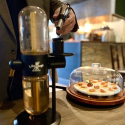 Libertango Steakhouse - Provoleta Dehumada . Smoked at your table