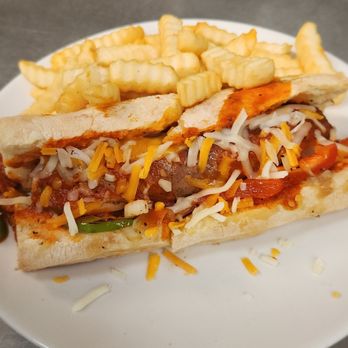 Graham's Grill & Pub - Sausage Brat Smothered with Marinara - Burgers Near Me - North Sioux City, South Dakota Graham's Grill & Pub - Sausage Brat Smothered with Marinara - Burgers Near Me - North Sioux City, South Dakota