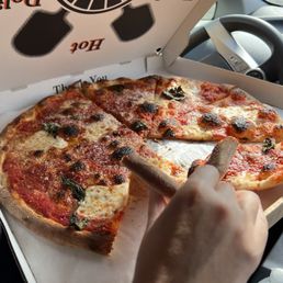 Margherita in the car - first bite was too tempting to wait for a photo Margherita in the car - first bite was too tempting to wait for a photo