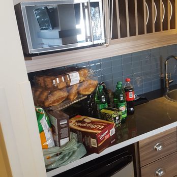 Estérel Resort - Mini kitchen with our snacks. There's a microwave, toaster oven and fridge along with all dishware - Resorts Near Me - Estérel, Quebec