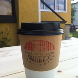 a coffee cup on a table a coffee cup on a table