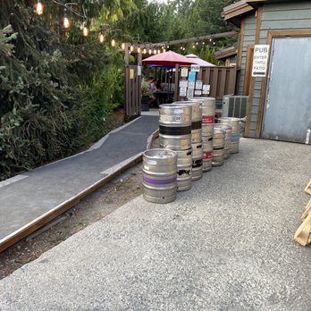 Roland's - a row of kegs lined up in front of a building - Pubs Near Me - Whistler, British Columbia Roland's - a row of kegs lined up in front of a building - Pubs Near Me - Whistler, British Columbia