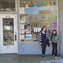 Creative IQ Art Studio - Owner, Suzie Ferras, with a student.