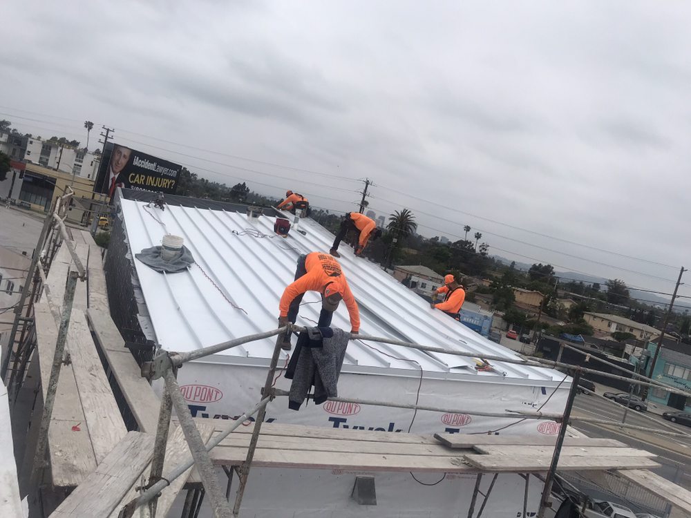 Slide of MA Roofing and Gutters