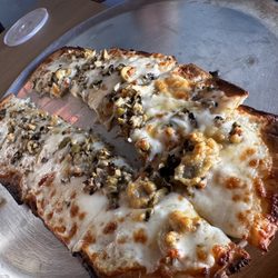 Up To No Good Tavern - Olive flatbread loaded with garlic