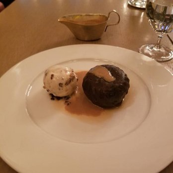 Berners Tavern - Christmas Pudding with Brandy Caramel sauce and rum/raisin ice cream - British Near Me - London, LND Berners Tavern - Christmas Pudding with Brandy Caramel sauce and rum/raisin ice cream - British Near Me - London, LND