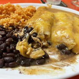 Shredded spicy chicken enchiladas with black beans and rice Shredded spicy chicken enchiladas with black beans and rice