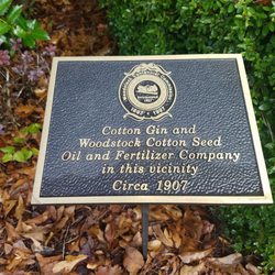 City of Woodstock - Historical marker in front of the Welcome to Woodstock sign