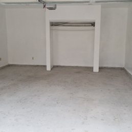 Before picture. Terrible concrete done from previous construction worker. MR GARAGE was able to fix it.