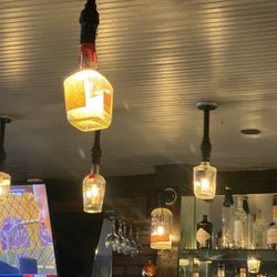 Golden's Pub And Deli - Bourbon bottle lighting!