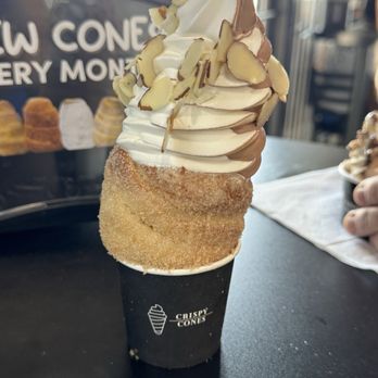 Crispy Cones - Cone (Nutella inside) with chocolate and vanilla swirl, topped with almonds - Ice Cream & Frozen Yogurt Near Me - Orlando, Florida Crispy Cones - Cone (Nutella inside) with chocolate and vanilla swirl, topped with almonds - Ice Cream & Frozen Yogurt Near Me - Orlando, Florida
