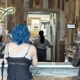 Blue haired girl that pointed and whispered and let the door shut in our face.