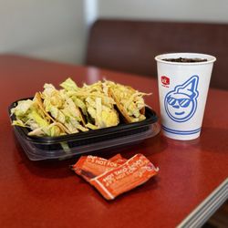 Jack in the Box - Four tacos, xtra lettuce and a Diet Coke.