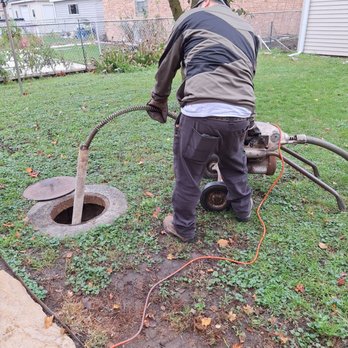 Nuzzo Sewer & Plumbing - Nuzzo's guy Rodding out the main sewer line - Plumbing Near Me - Chicago, Illinois Nuzzo Sewer & Plumbing - Nuzzo's guy Rodding out the main sewer line - Plumbing Near Me - Chicago, Illinois