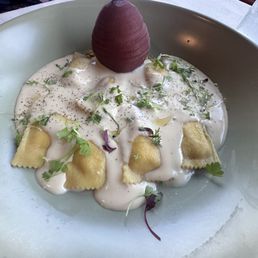 Pear ravioli with poach pear in wine