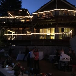 Skyhouse Project - Party lights on house at dusk looking from North from patio