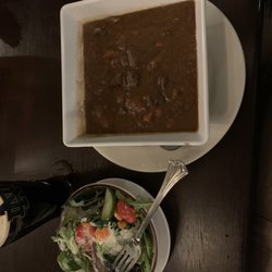 Irish House Restaurant and Trinity Pub - Hearty bowl of beef stew and a side salad, and a pint of Guinness.