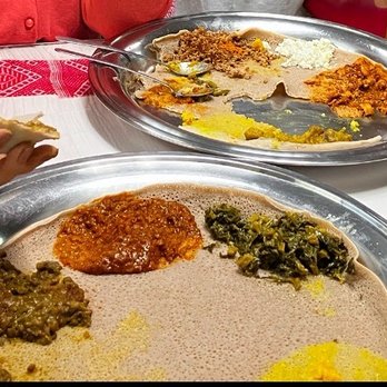 Zeni Ethiopian Restaurant - Two community platters: one veg and one with meats. See that teeny ramekin with spice powder. - Ethiopian Near Me - San Jose, California Zeni Ethiopian Restaurant - Two community platters: one veg and one with meats. See that teeny ramekin with spice powder. - Ethiopian Near Me - San Jose, California