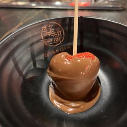 Chocolate fondu heart-shaped strawberry