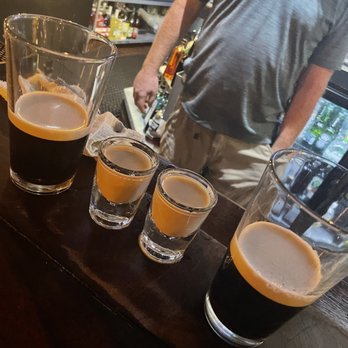 Molly Magees - a row of beer glasses on a bar - Irish Pub Near Me - Mountain View, California