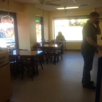 Honeyspot Pizza - a woman standing in a restaurant - Pizza Near Me - Stratford, Connecticut