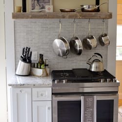 White Wood Kitchens - Rustic Shelves, Hanging Pots, Carrerra Marble tile in a great White Kitchen