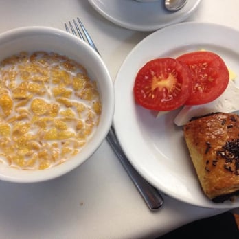 Amayra - breakfast buffet assortment #3: frosted flakes, tomato slices, cheese, and a chocolate croissant - Mediterranean Near Me - Madrid, M