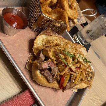 Guy Fieri's Kitchen + Bar - Steak sandwich and fries - American Near Me - Council Bluffs, Iowa Guy Fieri's Kitchen + Bar - Steak sandwich and fries - American Near Me - Council Bluffs, Iowa