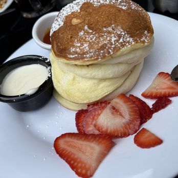 Kitch Cafe - Soufflé pancake with sweet cream and strawberry mango syrup in the side - Breakfast & Brunch Near Me - Fullerton, California