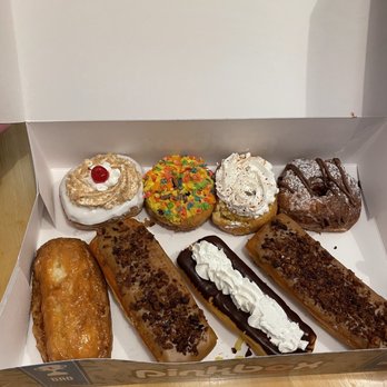 Pinkbox Doughnuts - Top: cherry bomb, tutti-frutti, mama's tres leches, Nutella face doughcro. Bottom: buttermilk bar, porky, ding dong, porky. - Donuts Near Me - St. George, Utah