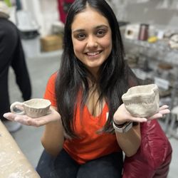 Crystal Shade Pottery - Student with her pottery