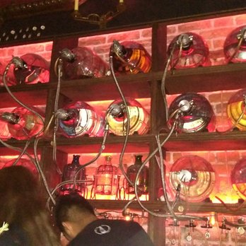 Photo of La Clandestina - Ciudad de México, CDMX, Mexico. Turns out these bottles aren't for decoration, they're full of mezcal :)