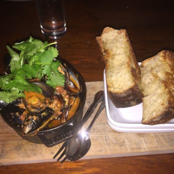The Raymond 1886 - Steamed Blue Mussels, angry lady sauce, Chinese sausage, Thai chili, toasted bread - New American Near Me - Pasadena, California The Raymond 1886 - Steamed Blue Mussels, angry lady sauce, Chinese sausage, Thai chili, toasted bread - New American Near Me - Pasadena, California