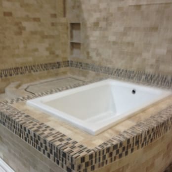 Pro Flooring - a bathtub in a tiled bathroom - Carpet Installation Near Me - Lewisville, Texas Pro Flooring - a bathtub in a tiled bathroom - Carpet Installation Near Me - Lewisville, Texas