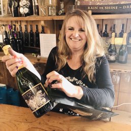She sells me my bottle of "Bubbly"! (Only