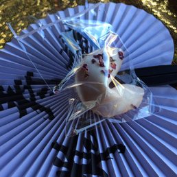 a fortune cookie on a paper fan a fortune cookie on a paper fan