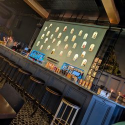 The Botanist Social - Wall of liquor behind the bar
