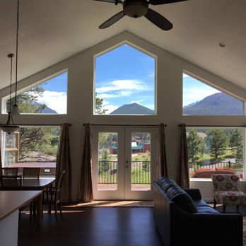 Northern Colorado Carpets - a living room with a view of the mountains - Carpeting Near Me - Fort Collins, Colorado