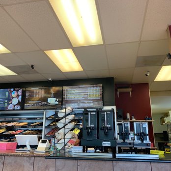 Donut Mart - a counter with a variety of donuts - Donuts Near Me - Albuquerque, New Mexico