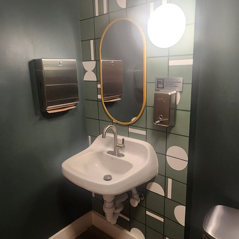 Greenhaus Coffee - a bathroom with a sink and mirror - Coffee & Tea Near Me - Sidney, Ohio Greenhaus Coffee - a bathroom with a sink and mirror - Coffee & Tea Near Me - Sidney, Ohio