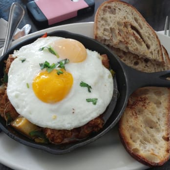 Eats - Pork on a skillet( I don't remember the name ). Don't be fooled, there's a lot of pork under that egg. - American Near Me - San Francisco, California