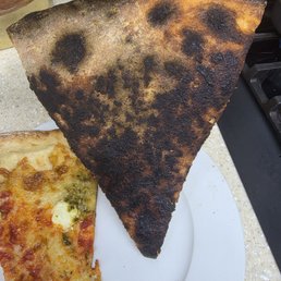 Burnt Nose Candy and background is the Shakedown with too much crust and uneven sauce distribution.